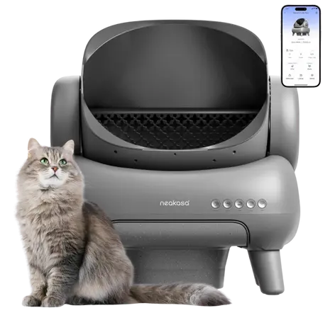 Fluffy cat next to the Neakasa M1 automatic litter box with mobile app, a large-capacity self-cleaning option that works with Pretty Litter.