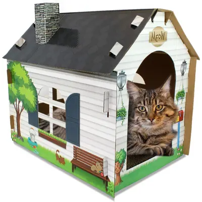 ASPCA cardboard cat cottage with black pitched roof, illustrated walls, and front entrance